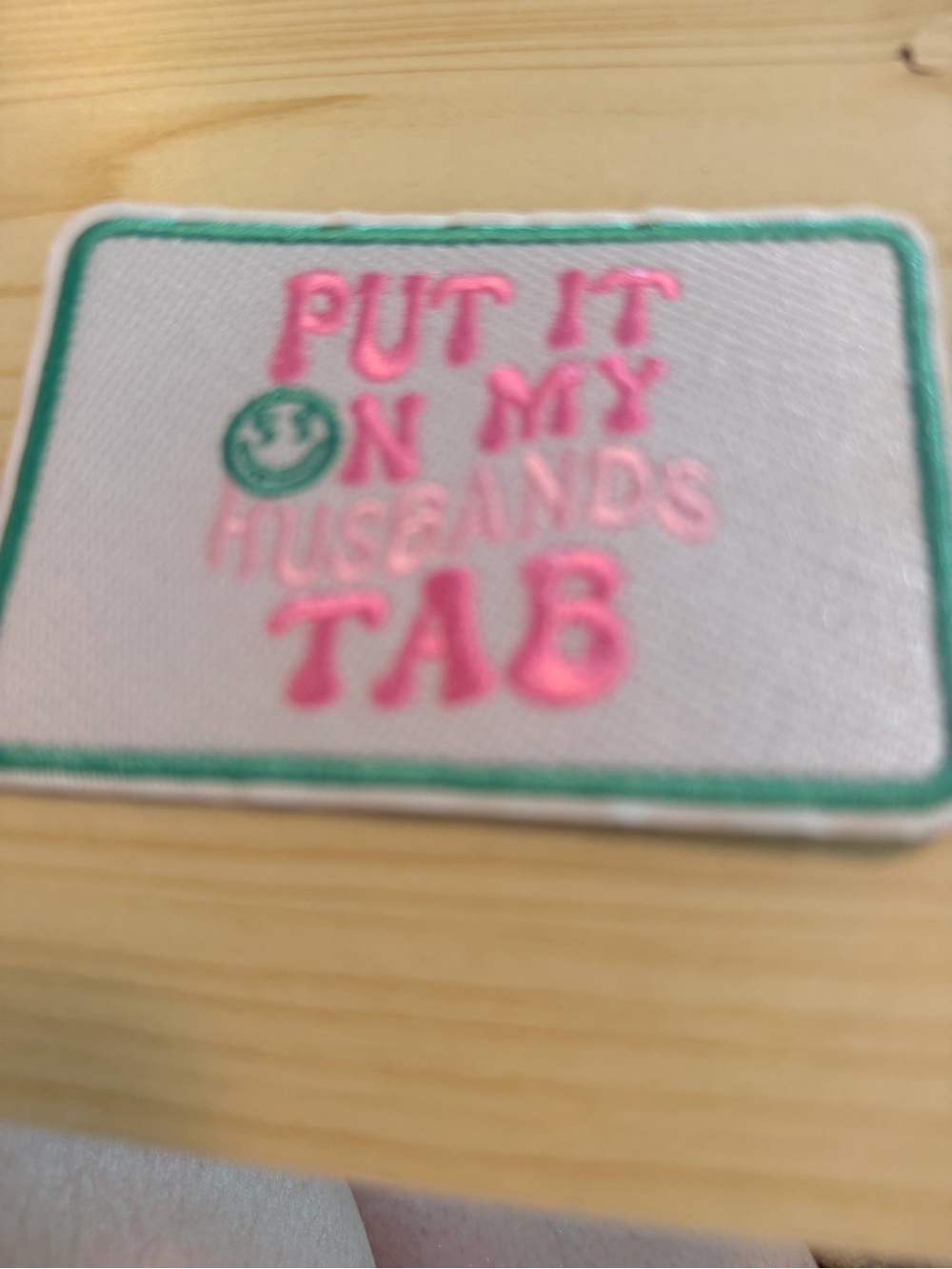Embroidered Pink Patch — "Put It On My Husband's Tab"
